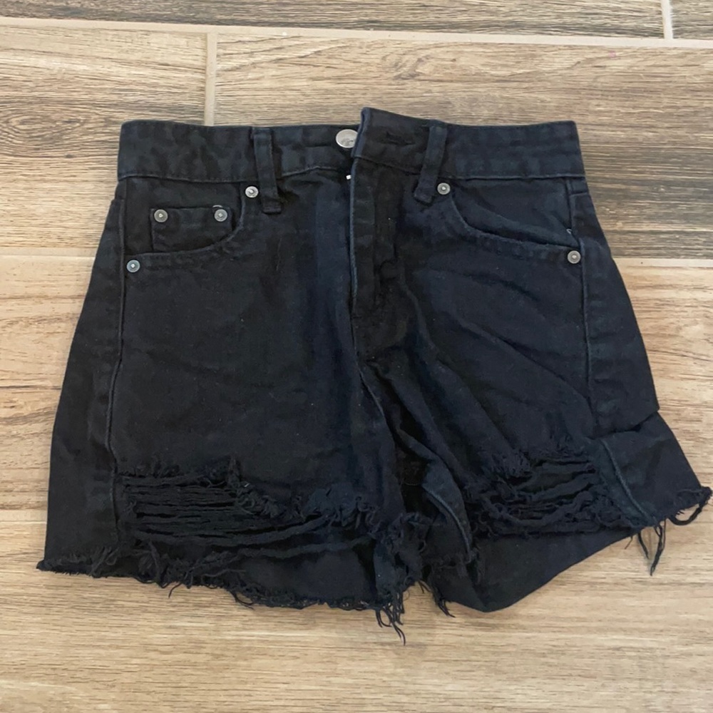 black ripped shorts